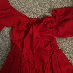 Super cute off the shoulder and ties in the back! Vici red dress!